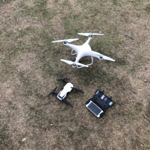 white DJI Mavic Pro drone set on grass